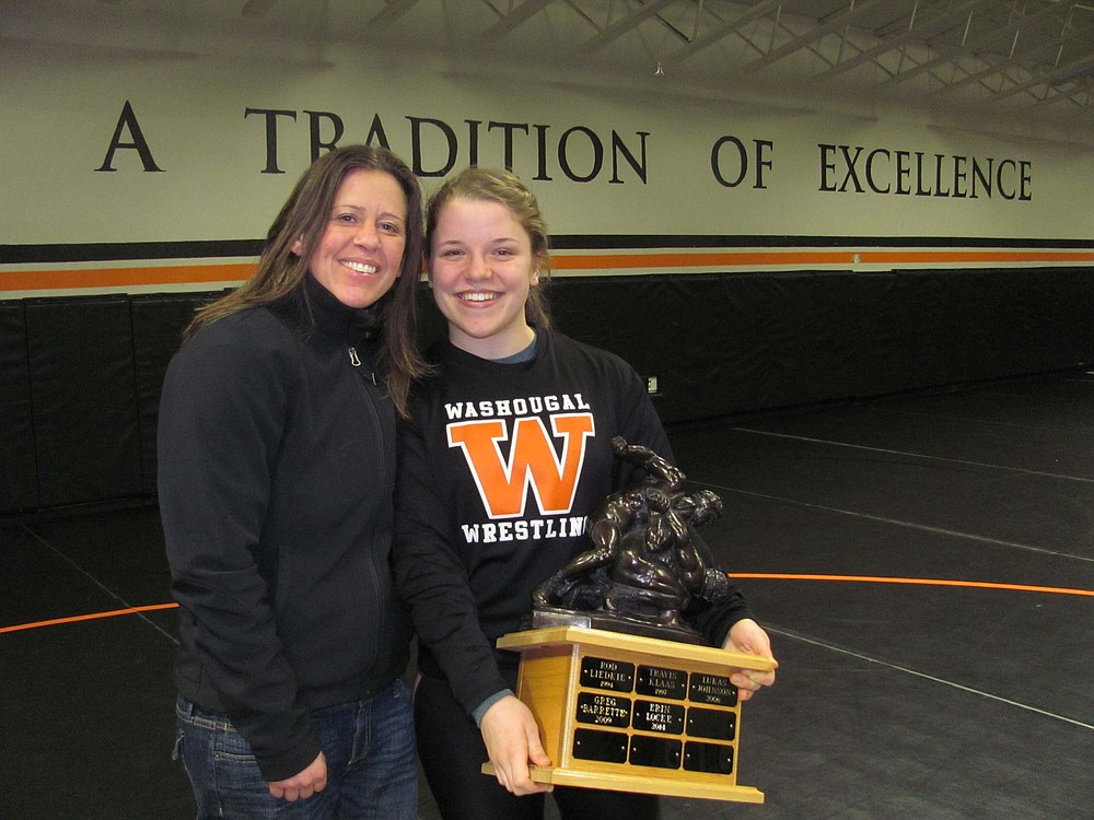 Erin Locke (right) shares a proud moment with coach Heather Carver (left). Locke became the first female to win Washougal High School Wrestling's Ultimate Ironman award.