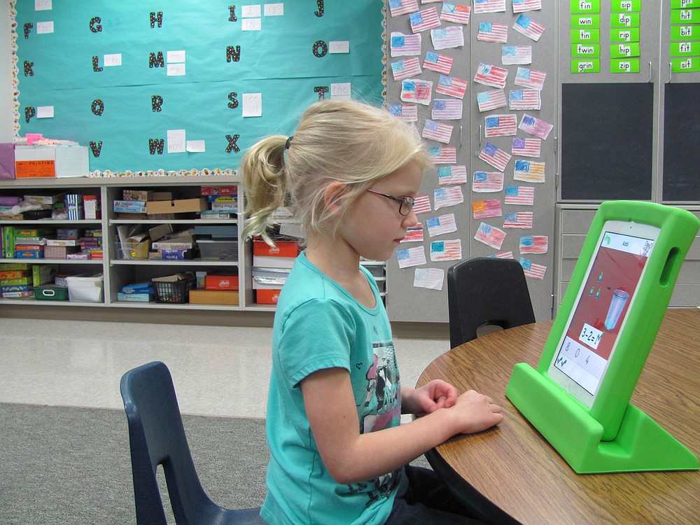 Addi Gibbons works with the "Teach Me Kindergarten" app on an iPad at Cape Horn-Skye Elementary School. Teacher Cindy Coons said the device is ideal for her students because it helps them learn at their own pace.