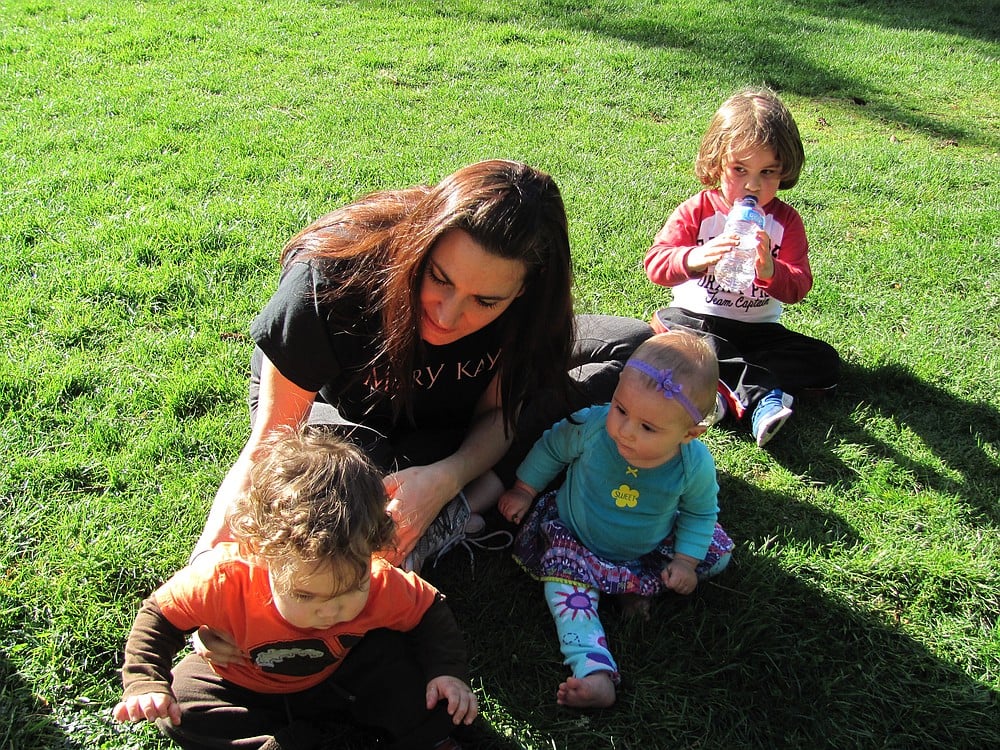 Elizabeth Soth holds Paul Garrett, 14 months, while her daughter, Isla, 9 months and son, William, 3, look on. Soth and her children visit Heritage Park regularly. Garrett was there with his father, Kelly, not pictured.