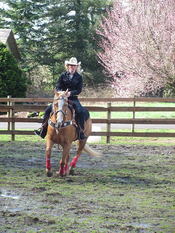 Amanda Knapp rides Carter, one of the geldings on property owned by her parents, Brian and Janis. Knapp, a 2011 Washougal High School graduate, has competed in various open shows and rodeos, as well as in 4-H and on the WHS equestrian and drill teams.