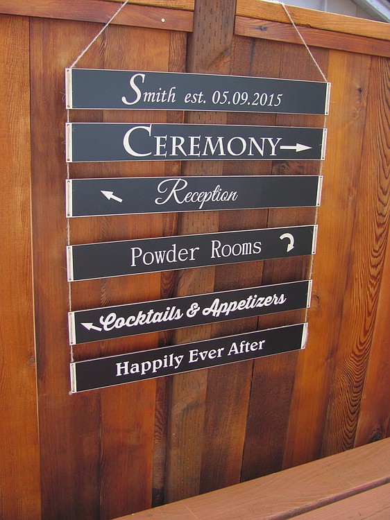 This type of directional sign is popular for outdoor weddings, according to Gorman. It includes products produced by Charlie Chalk Designs, as well as JimboGee custom wood designs, created by her husband, Jim.