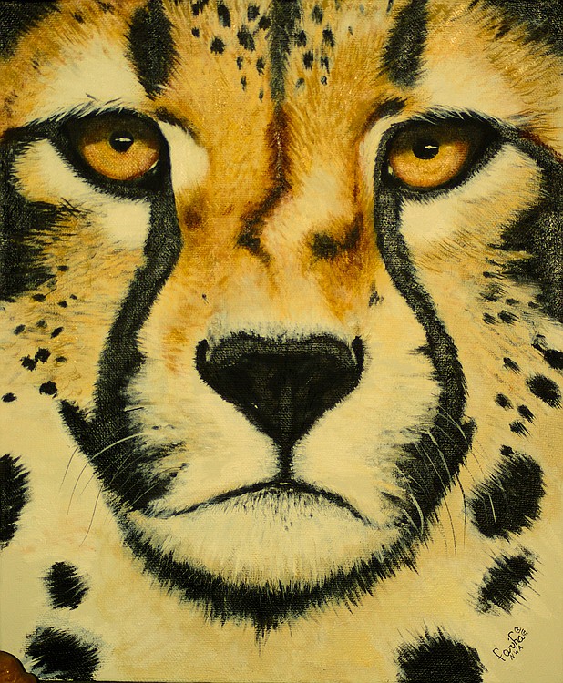 This cheetah was created with oil paints on jesso board.