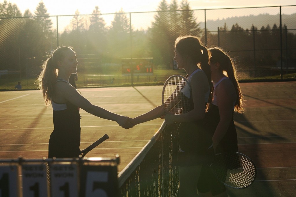 Jessica Eakins shakes Stephanie Schuldt's hand after a three-set doubles match between the Panthers and Papermakers Thursday, at Washougal High School. Schuldt and Lauren Belzer won to complete a Camas sweep.