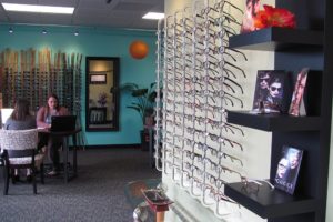 Julie Post, an optician at Vancouver Vision Clinic, assists a patient with the process of ordering glasses. The clinic recently relocated within downtown Camas. "We outgrew our other space," Post said. The remodeled location features three exam rooms and a larger optical department.