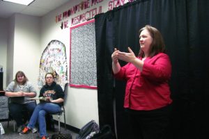 Tami Grant, an American Sign Language teacher at Washougal High School, was recently named Interpreter of the Year for Sorenson Communications. Here, she works with her students on songs for their end of the year show.