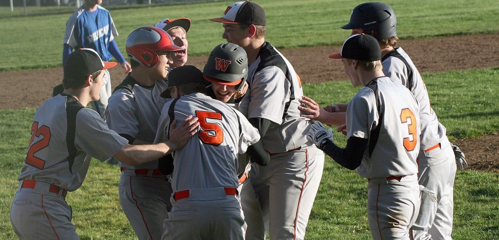 Panthers roughhouse on the diamond after Brandon Casteel brought home the winning run in a 6-5 victory against La Center in eight innings Thursday, at Washougal High School.