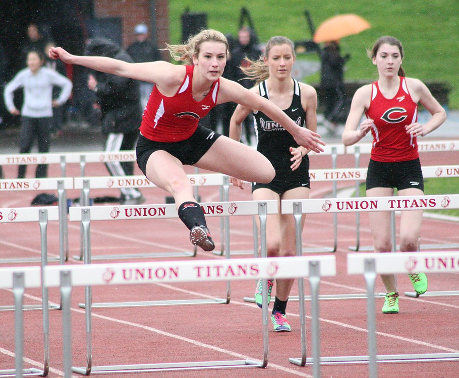 Jordan Davis flies over the hurdles for the Papermakers March 24, at Union High School. The senior set new school records in the 100 and 300 hurdles. On Saturday, she became the Tiger Invitational Female Athlete of the Meet.