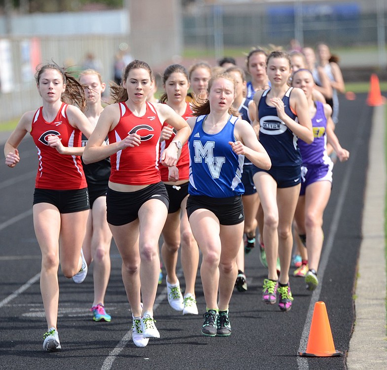 Alissa Pudlitzke (center), Emma Jenkins (left) and Maddie Woodson (background) grabbed the top three places for Camas in the Tiger Invitational 1,600-meter run Saturday, at Battle Ground High School.