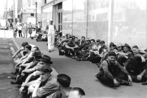 Crown Zellerbach paper mill workers wait to start their shift sometime during the 1940s. The Coca-Cola sign in the background is attached to the building that now houses the Mill Corner Tavern at Northeast Fourth and Adams Street. The building the employees are sitting in front of no longer exists. Columbia River Paper Co. was incorporated in 1884 by Henry L. Pittock, publisher of The Oregonian. It became Crown Zellerbach following a merger in 1928, which it remained for 60 years.