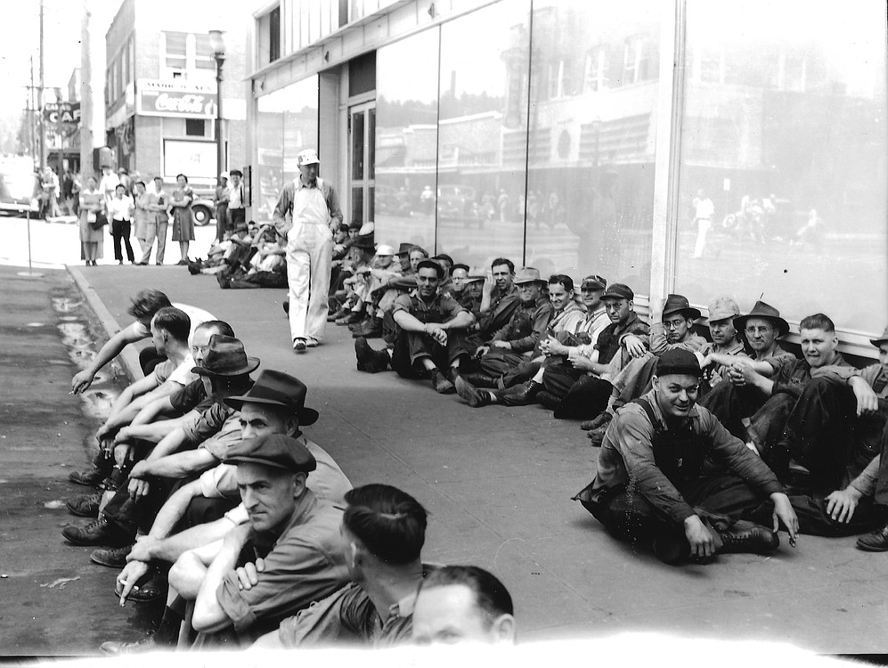 Crown Zellerbach paper mill workers wait to start their shift sometime during the 1940s. The Coca-Cola sign in the background is attached to the building that now houses the Mill Corner Tavern at Northeast Fourth and Adams Street. The building the employees are sitting in front of no longer exists. Columbia River Paper Co. was incorporated in 1884 by Henry L. Pittock, publisher of The Oregonian. It became Crown Zellerbach following a merger in 1928, which it remained for 60 years.