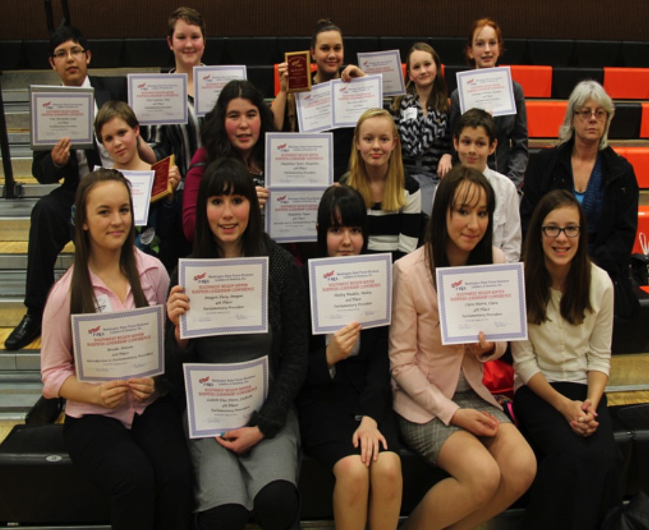 Jemtegaard Middle School FBLA members proudly show off their awards at the regional competition. With them is advisor Susan Nesmith.