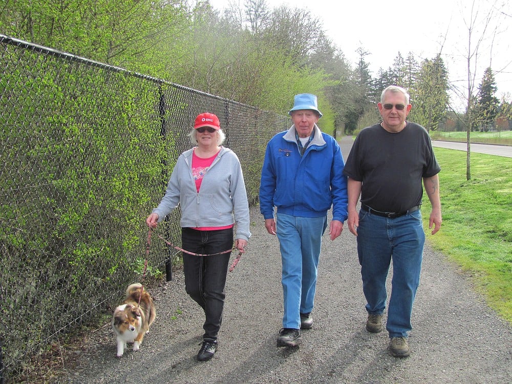 Dixie, Maureen Hursh, Larson and Friend finish a walk at Heritage Trail recently. Friend met the trio in August when he first began walking.