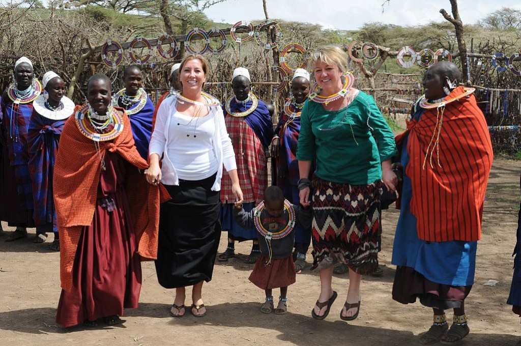 Alicia Seaman (left) and Julie Scott-Seaman dance with the Masai in their village between Tararangire and Ngorongoro.