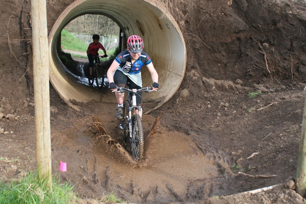 Washougal's Sharon Hart splashes out of one of the tunnels.
