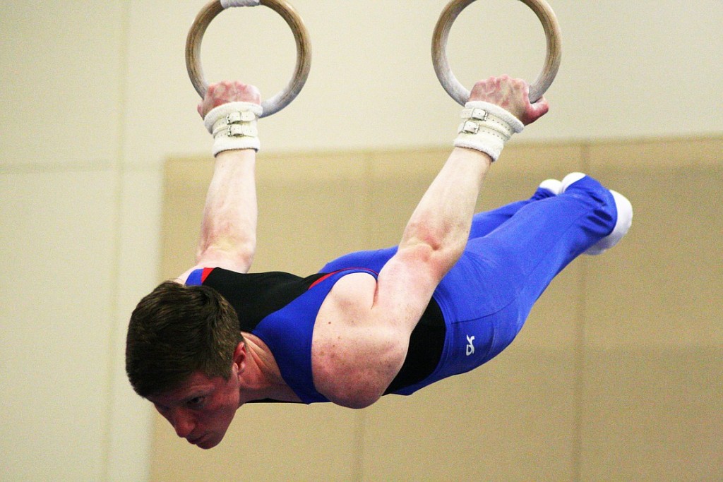 Trace Jacquot holds still on the rings during the Level 10 regional gymnastics championships Saturday, at the Clark County Event Center, in Ridgefield. The VEGA gymnast from Hockinson finished in first place on the high bar and third place on the floor.