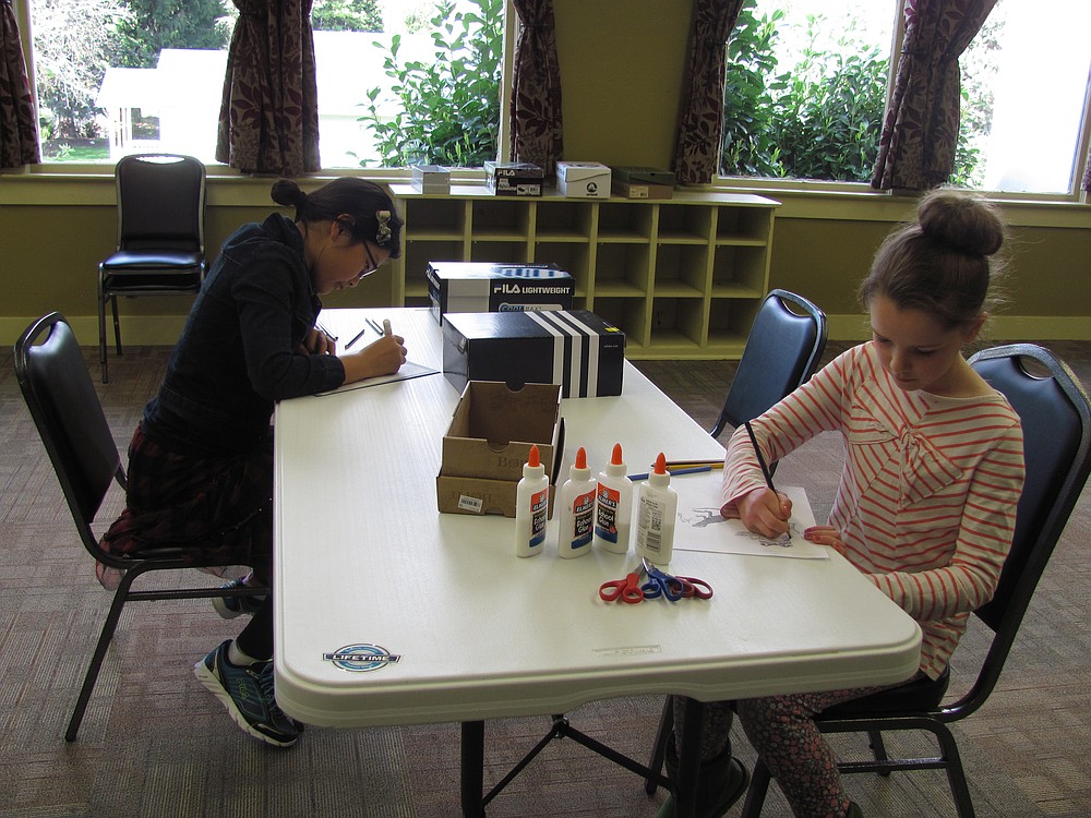 Esther Kim (left) and Wright are regular attendees at the art classes. Parker's current series involves recycled art.