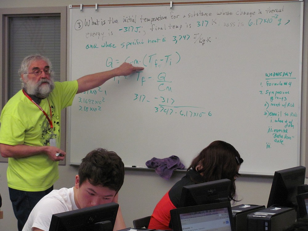 Wright reviews material for an upcoming technology test with ninth-grade students in the Math, Science and Technology Magnet Program. In addition to teaching MST courses, he leads the Science Olympiad program, teaches an Advanced Placement computer programming class, serves as a volunteer coach for students in the State Science and Engineering Fair, and coordinates internships for students.