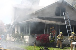 Emergency crews work to put out a house fire at 1524 S.E. Seventh Ave., in Camas. Firefighters from Camas, Washougal and East County Fire and Rescue were dispatched at approximately 11:30 a.m. today.