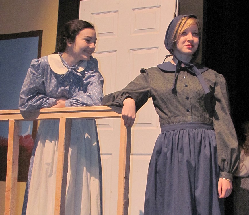 At right, Sarah Vonham (Robyn Pfeifer) shares a story with her daughter (Zoe West).  WHS drama students will perform "Quilters" the next two weekends at the Washburn Performing  Arts Center.