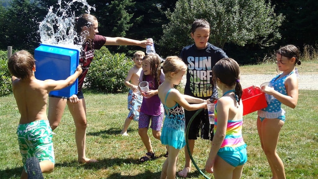 Attendees at "Ooey Gooey" at Camp Windy Hill  in Washougal enjoy a break to cool off during a hot summer day. There are several options for camps in the local area.