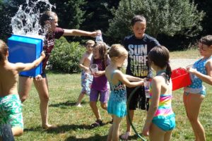 Attendees at "Ooey Gooey" at Camp Windy Hill in Washougal enjoy a break to cool off during a hot summer day. There are several options for camps in the local area.