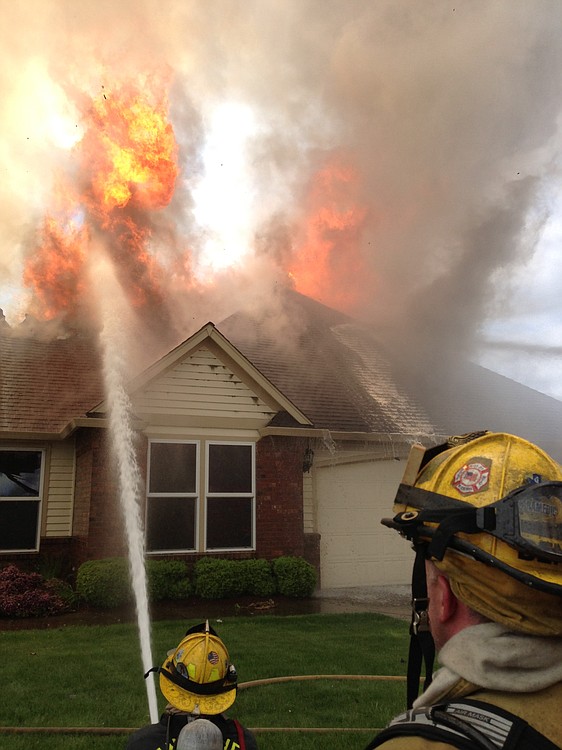 Photo courtesy of the CWFD
Firefighters battle a fire at 3627 N.W. Sierra Drive. Brian Murray, the 19-year old son of the homeowners Alan Murray and Pat Jensen, told police he was trying to burn his bank statements on dirt under the deck when the fire accidentally spread to a gasoline can and the house.