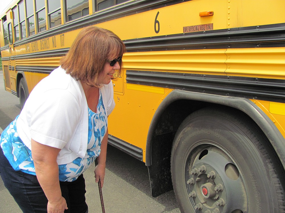 Chyrel Uthe completes a pre-trip check before heading out on her afternoon route for the Camas School District.
