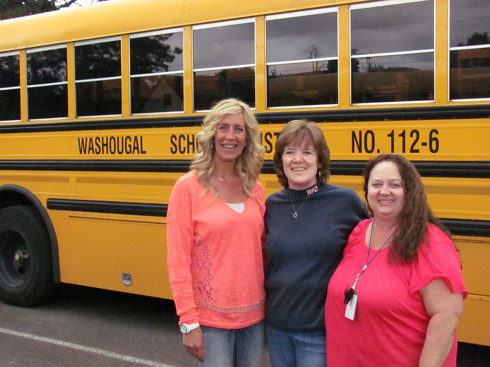 Washougal School District bus drivers, from left, Rachael Bentley, Charlie Dawson and Connie Allred credit a postive work environment as the reason for their longevity on the job. "You couldn't ask for a better group of people," Allred said.