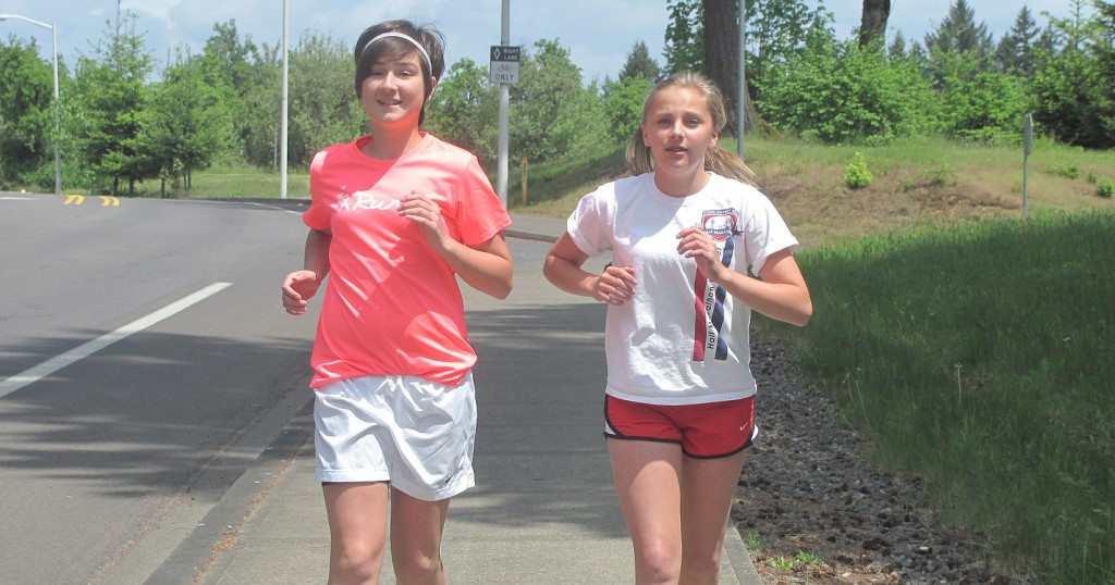 Paige McCray (left) and Lindsey Lattimer are heading into the final weeks of half-marathon training.