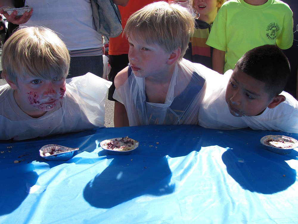 Youngsters pause for a moment after the mini pie eating contest at the 2013 Camas Farmer's Market. The popular event is returning this year.