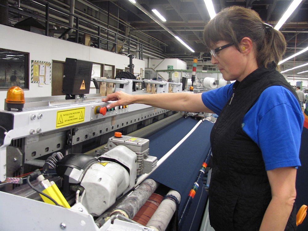 Lidiya Kovaz, a weaver with Pendleton Woolen Mill in Washougal, operates one of the two state-of-the-art weaving machines that were purchased in September 2011. The mill manufactures wool textiles, for use in blankets, men's and women's clothing and upholstery.