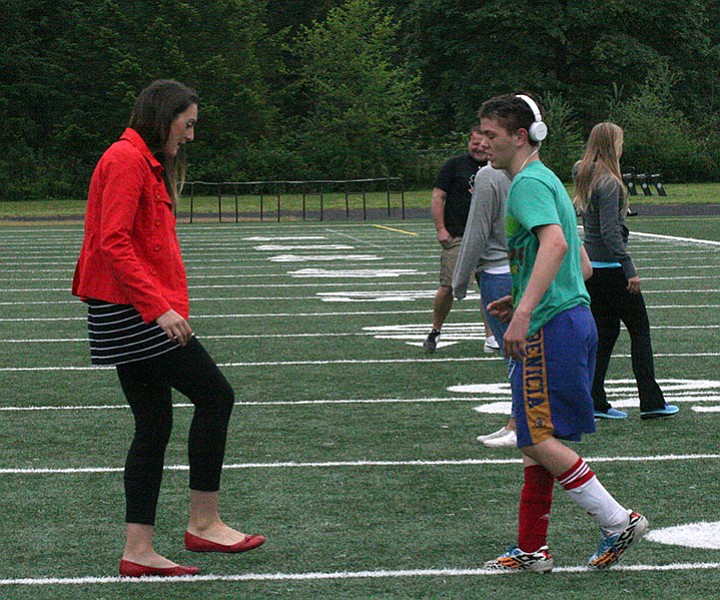 Kendal Vom Baur works with a player during a recent practice. The team includes special needs and general education students.