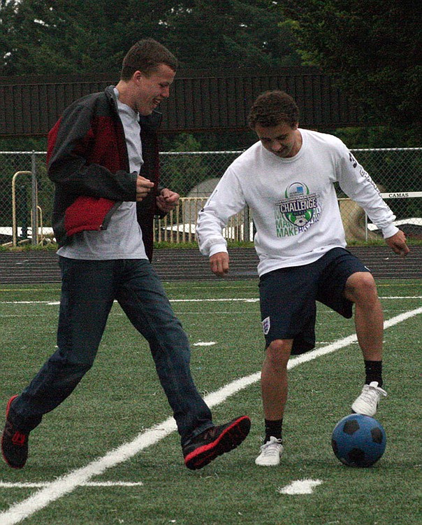 Ben Klave, left, works on a drill with Trevor Steenson. He describes the experience of participating with Unified Soccer as "exactly what I needed."