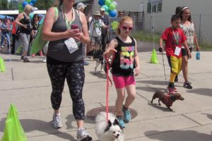 Nacy Hettling, of Washougal, (left) and her daughter, Aubrey, walk Hettling's parents' Pomeranian in the 2015 Hike on the Dike event, which raised more than $16,500 for the West Columbia Gorge Humane Society. The 2021 Hike on the Dike begins at 9 a.m. Saturday, June 26. (Post-Record file photo)