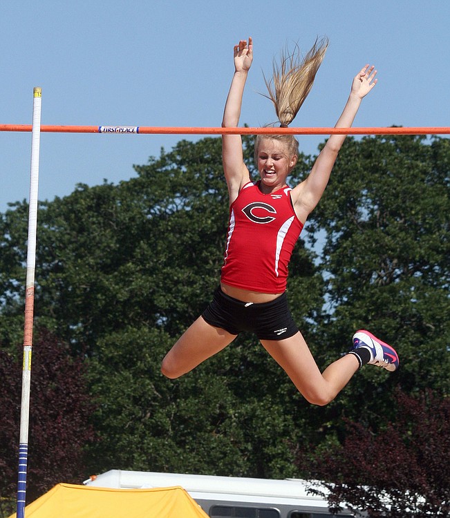 Caleigh Lofstead soars over the bar raised 12 feet off the ground to become a state champion for Camas in the pole vault. The bar went up another seven inches, and Lofstead cleared it again to set a meet record.