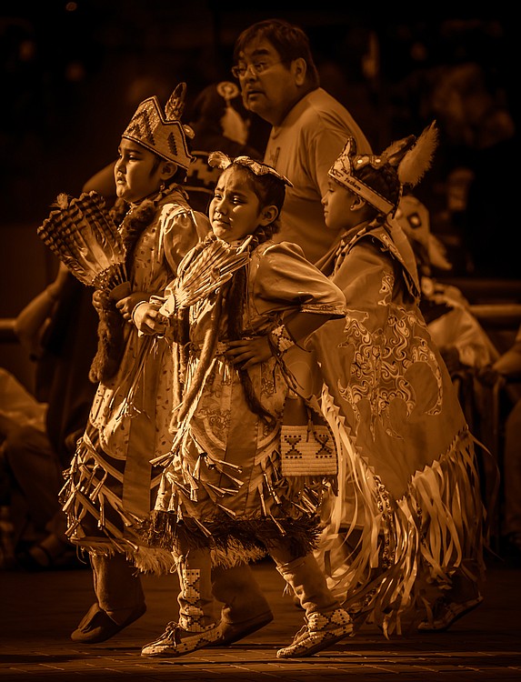Several generations of tribal members participate in a pow wow in downtown Portland in September 2012.