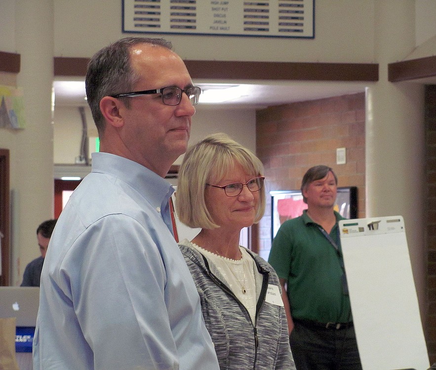 Current Washougal School District Superintendent Dawn Tarzian and her successor, Mike Stromme, address the crowd at the design symposium.