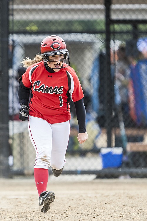 Lena Richards rounds the bases after hitting one of her two home runs against Lake Stevens in the first round of the state tournament.