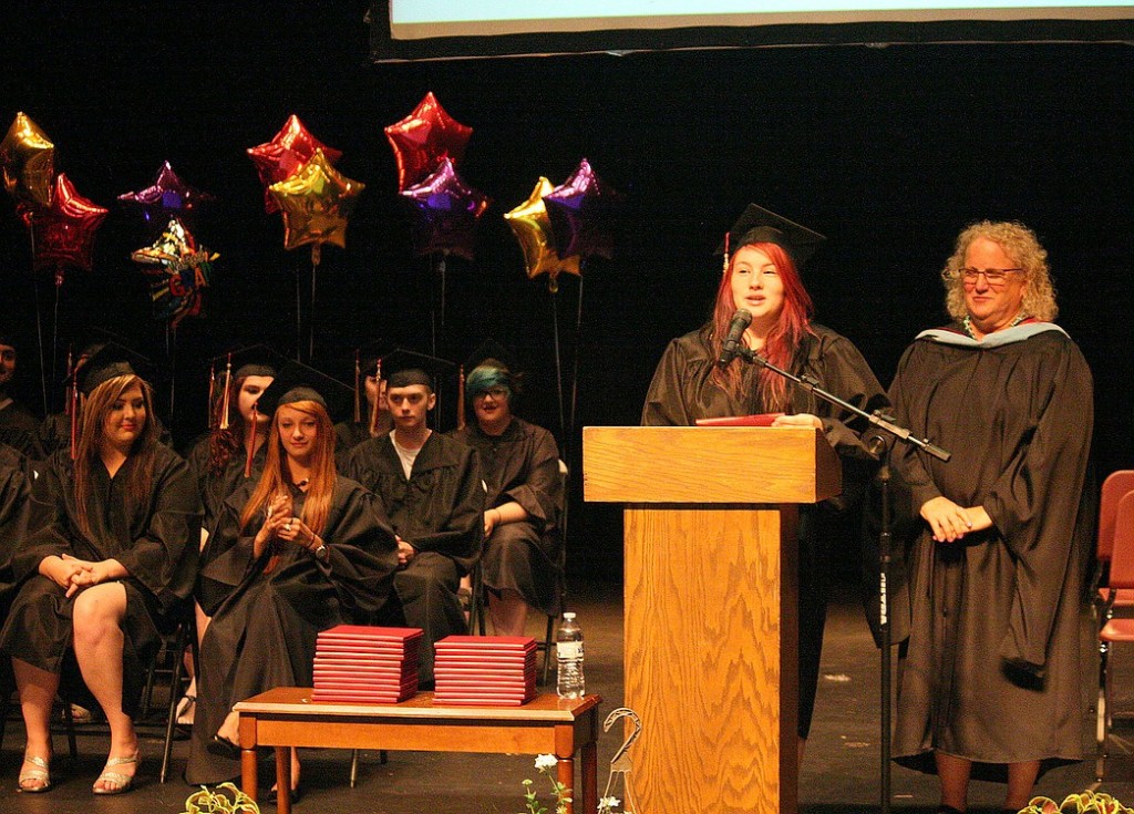 Brooke Beaudoin addresses the audience after receiving her diploma from Excelsior High School Principal Carol Boyden.