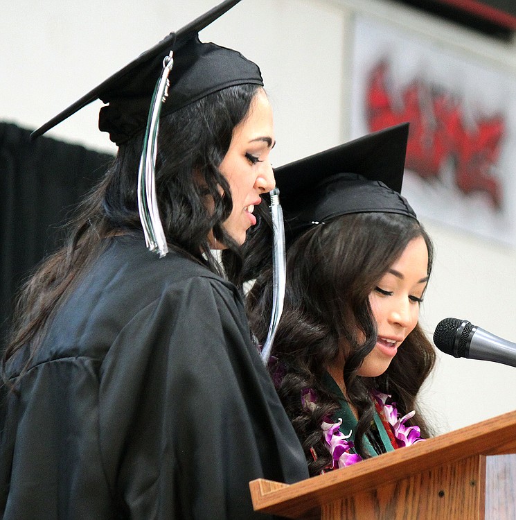 Teacher Monica Winkley chats with students Phoebe Jud,  Daniela Garcia and Bryson Dobson as they wait to begin Hayes Freedom High School graduation ceremonies Saturday.