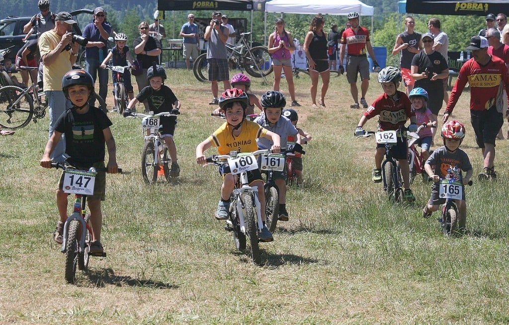 Parents, family members and spectators watch children take off on their bikes during Sunday's Race for the Future student mountain biking fundraising event, at Washougal Motocross Park.