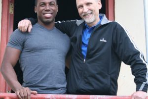 Alex Sturrup (left) visits his mentor Randy Fox (right) at VEGA during a vacation from dancing for Royal Caribbean. Fox will be inducted into the USA Gymnastics Region 8 Hall of Fame Saturday.