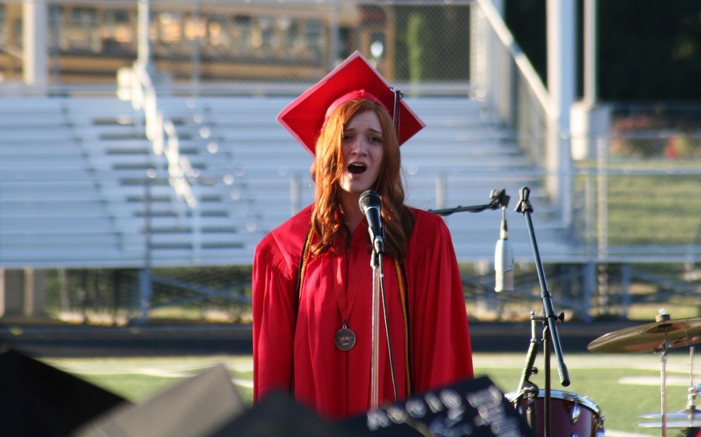 Katelynne Jones sings "You Raise Me Up," to cheers, tears and a standing ovation at commencement ceremonies Friday night.