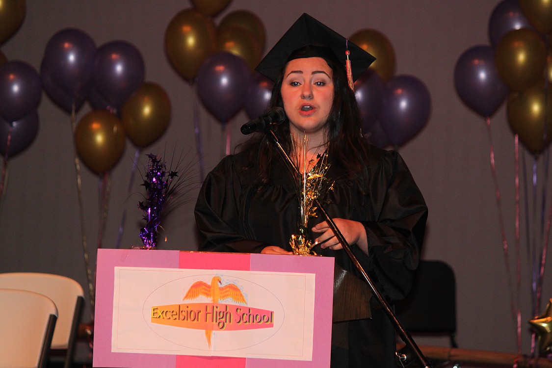 Audrey Sibley performs &quot;When I'm Gone,&quot; during Excelsior High School graduation ceremonies at the Washburn Performing Arts Center.  There were 19 students in the  2013 graduating class.