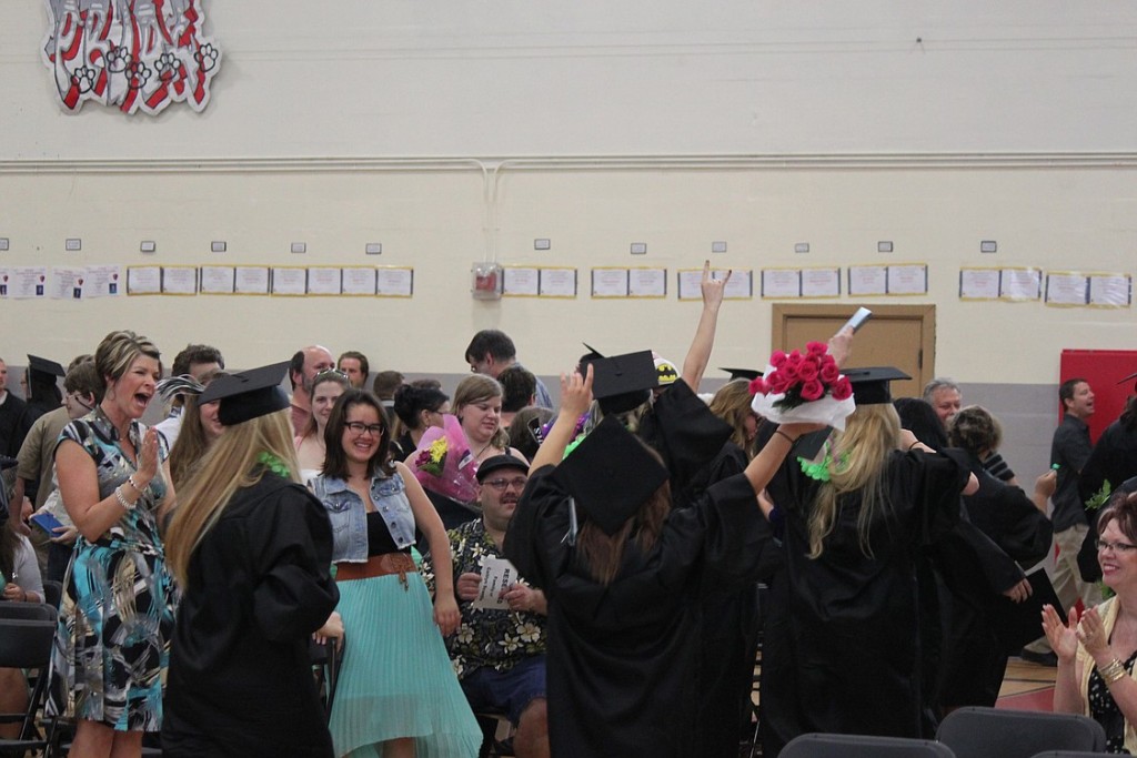 Hayes Freedom High School graduates and their family members and friends celebrate following ceremonies on Saturday.