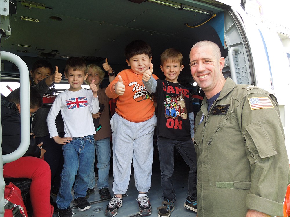 Jeff Lukowiak (far right), a resident agent-in-charge with the Coast Guard Investigative Service and a father of two Helen Baller students, arranged the visit, which included a presentation about water safety.