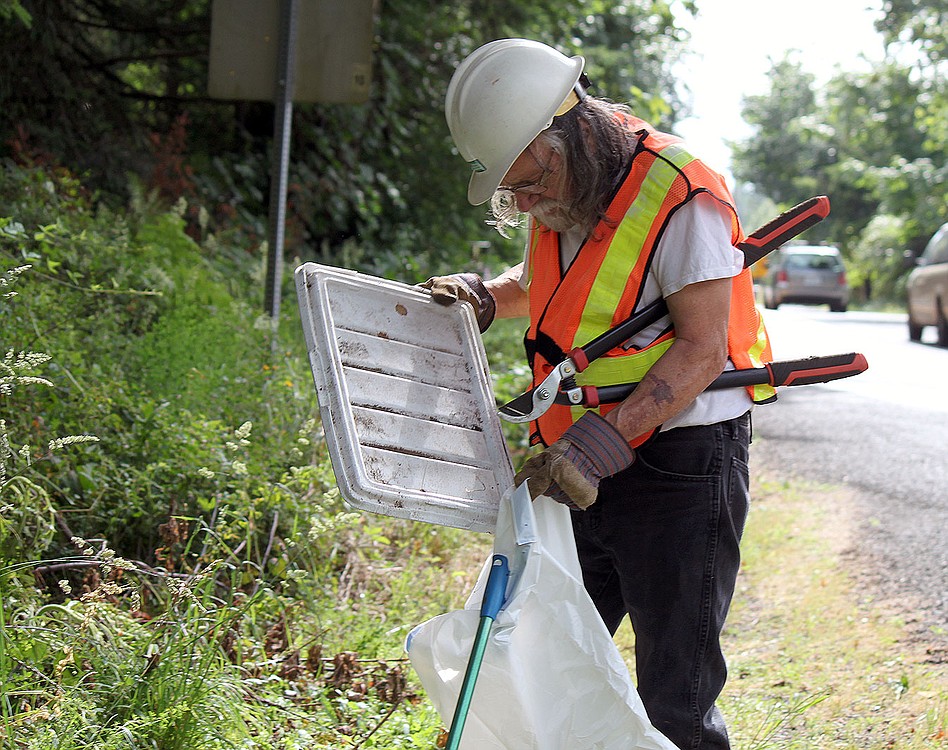 Jim Fisher, known in the local area as "the old hermit at Skunk Hollow," regularly picks up garbage along Everett Road in Camas as part of the WSDOT Adopt-a-Highway program. He is passionate about keeping the area clean and safe for walkers and bicyclists.