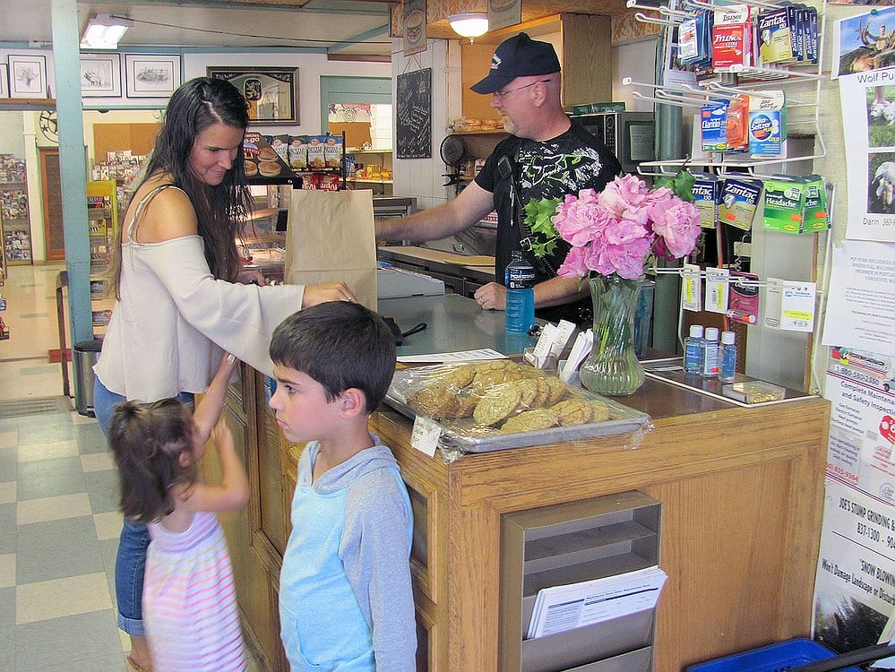 Customers of all ages enjoy visiting the Washougal River Mercantile. The owners of the store are six siblings, including Chris Fuller (right). He also serves as chief of Skamania County Fire District 4. "We are there to serve the community as best we can," Fuller said. "That's why all of the family volunteers in different ways at the American Legion, SCFD 4 and others."