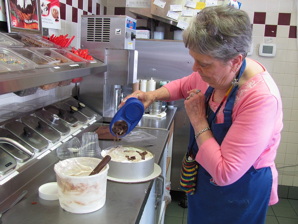 Wilma "Willi" McOmie makes an ice cream cake at the Dairy Queen in Camas. She and her husband David have owned the local franchise for 33 years. "I love it here, the community and the little kids," Willi said. "I can't imagine staying home."