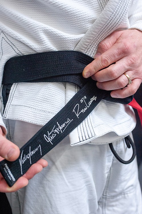 Photo courtesy of Dave Lord
Mel Locke shows off his new black belt in Grancie Jiu Jitsu. It took the 43-year-old student, fighter and trainer from Camas about 14 years to achieve this dream.